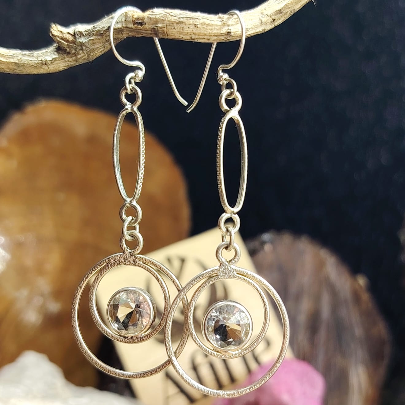 Aros largos con diseños circulares mas cristal translucido