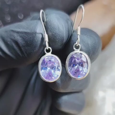 Aros semi largos con cristal amatista claro