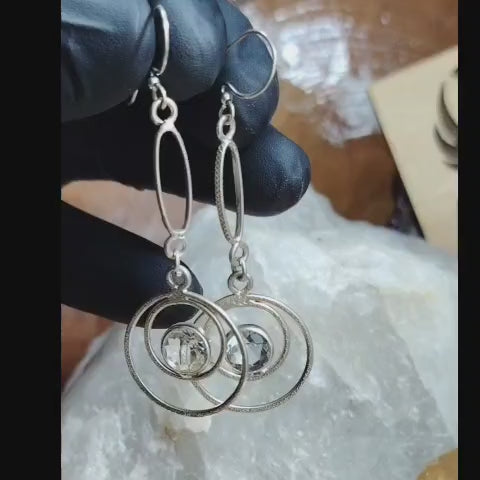 Aros largos con diseños circulares mas cristal translucido